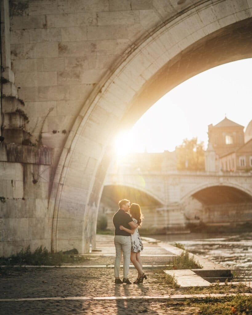 rome-engagement-photographer under a bridge at sunset. taken by yorkshire wedding photographer Yorkshire portratis