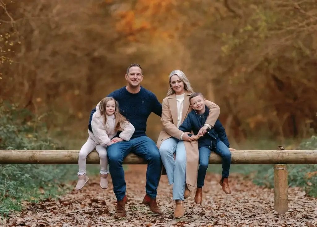 family of four in beautiful autumn park photograph. yorkshire family photoshoot in clumber park at autumn